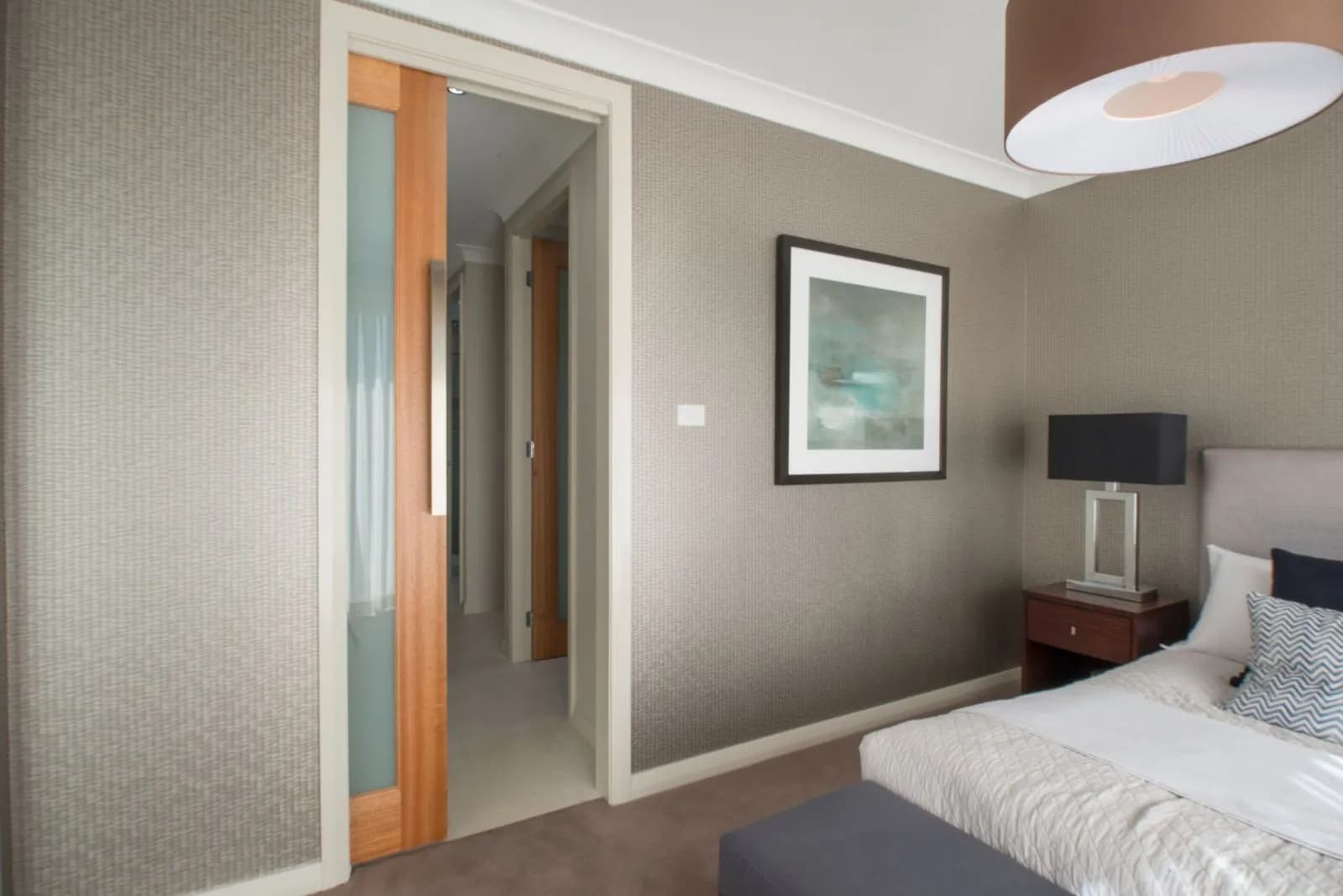 Timber pocket door sliding into a bedroom wall