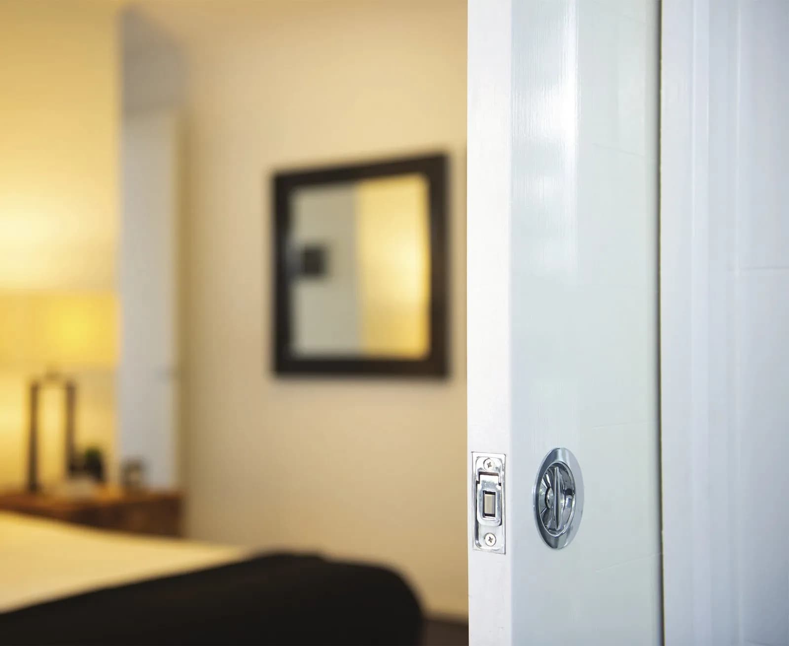 Flush privacy set and latch on a white pocket door
