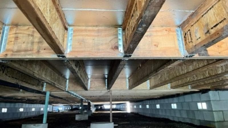 Subfloor ground clearance and ventilation requirements diagram for particle board flooring